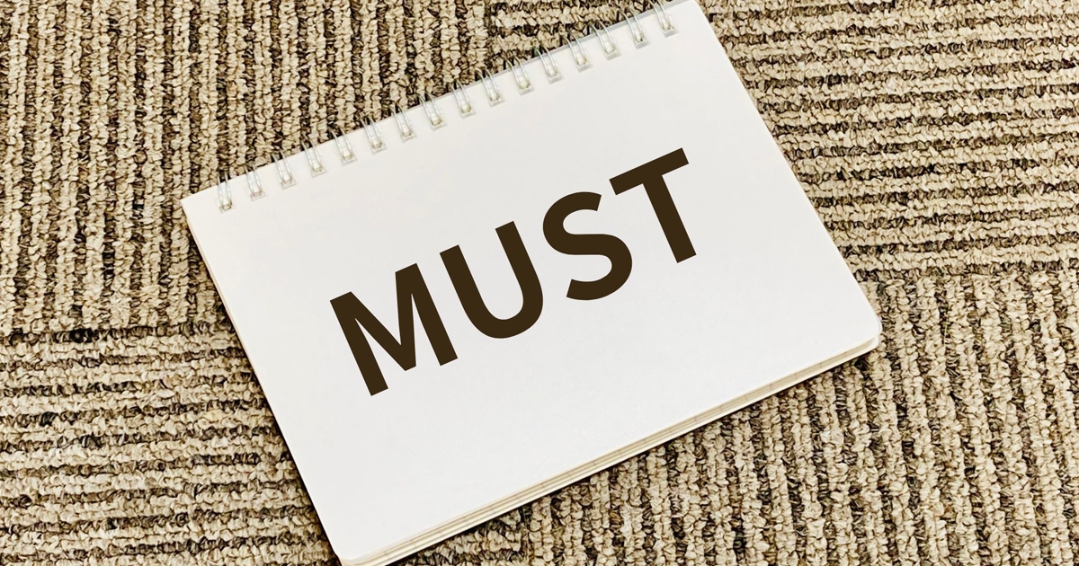 MUSTと書かれたスケッチブック