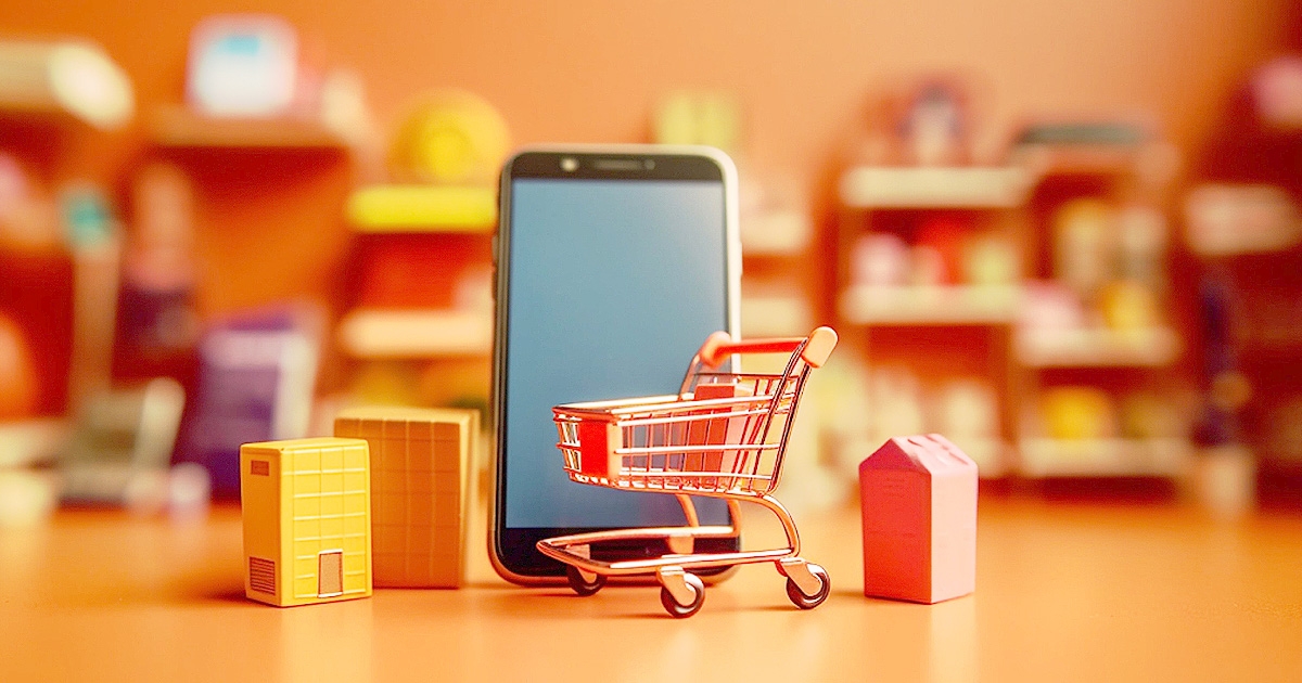 スマートフォンとミニチュアのショッピングカート